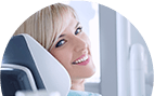 Young woman in dental chair smiling