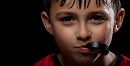 Young boy with sports mouthguard